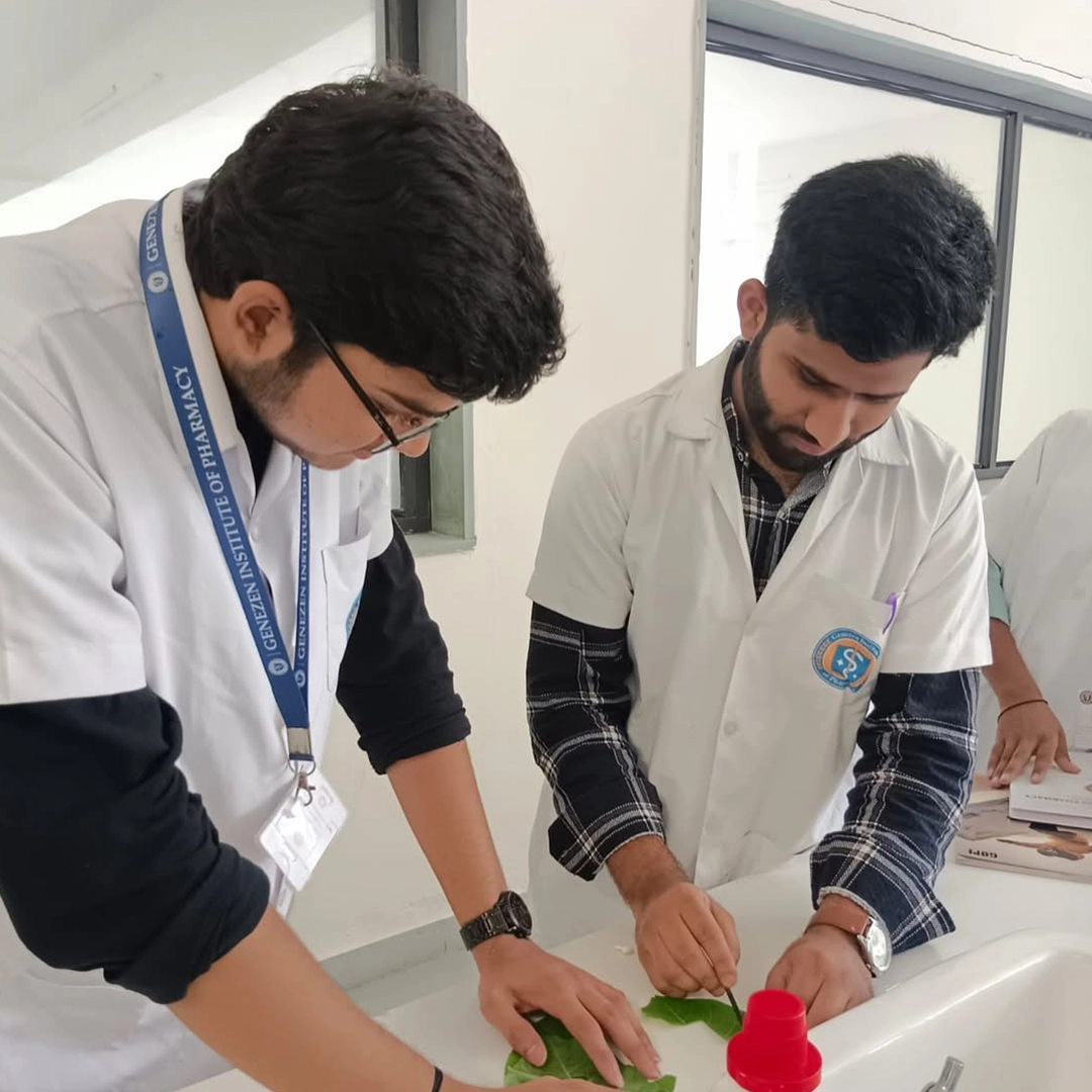 Students wearing branded ID card lanyards during a laboratory session in an educational institute.