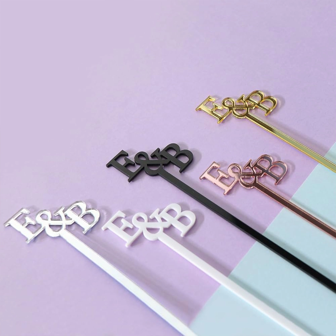 Personalized E&B drink stirrers in black, white, gold and rose gold