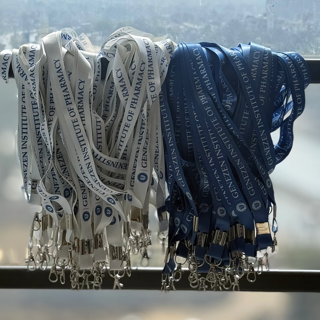 Customized blue and white logo ID card lanyards displayed together for branding.