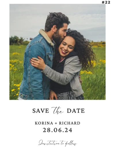 Happy couple hugging in a field