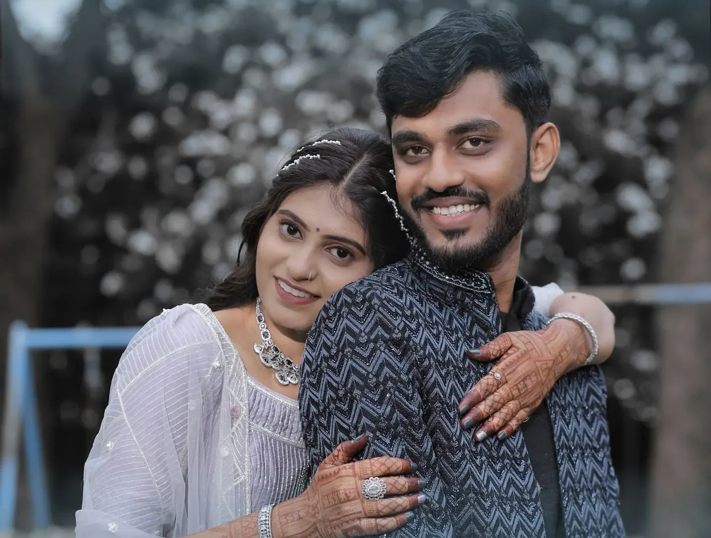Engagement photo with a couple smiling.